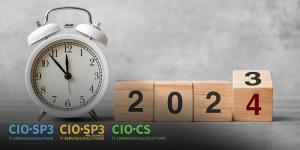 an image of a clock next to four wooden blocks spelling out the year 2024